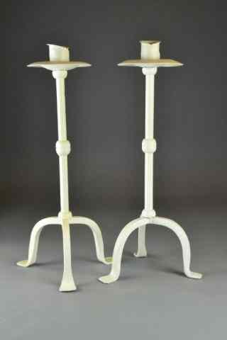 Appraisal: Pr Of Iron Paninted Candle StandsIvory painted candle stands with