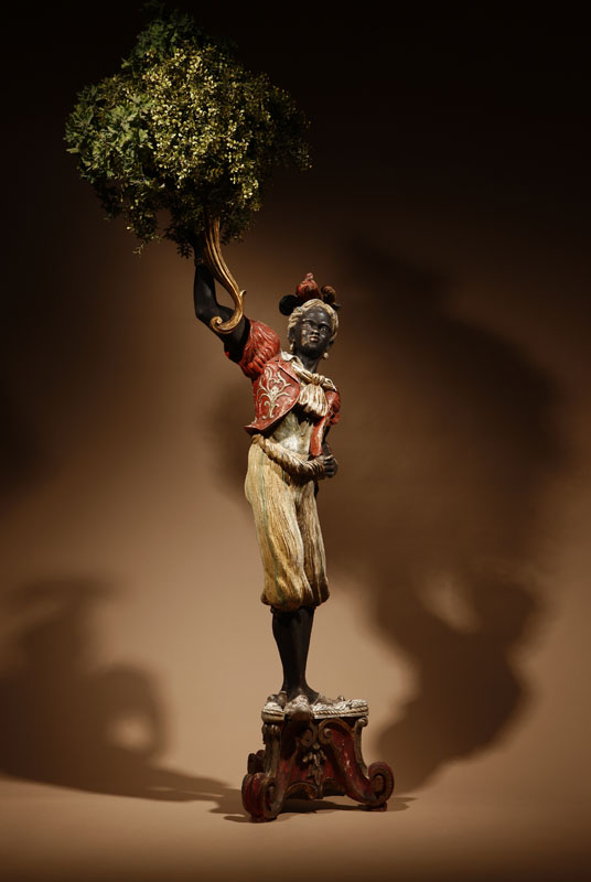 Appraisal: An Italian Rococo style polychrome-decorated figure of blackamoor An Italian