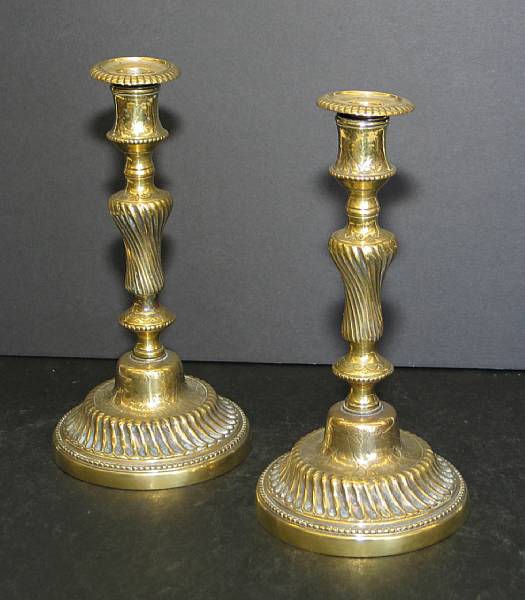 Appraisal: A pair of Louis XV silvered brass candlesticks mid th