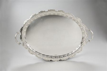 Appraisal: An Edwardian silver tray Mappin Webb Ltd Sheffield shaped oval