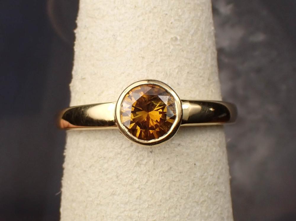 Appraisal: FANCY BROWN DIAMOND AND EIGHTEEN KARAT GOLD RING The yellow