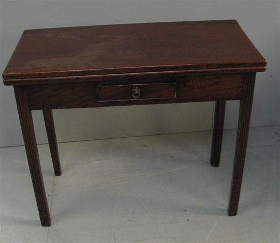 Appraisal: George III mahogany folding tea table with frieze drawer on