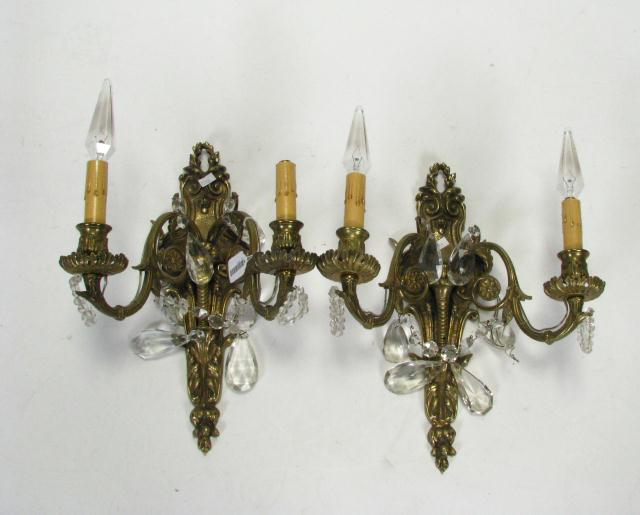 Appraisal: Pair of Electrified Cast Brass Sconces With faceted Prisms depicting