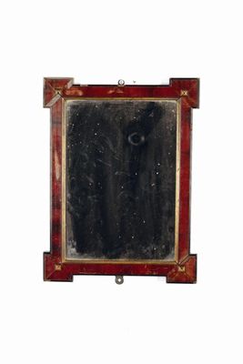 Appraisal: A continental small wall mirror with a simulated rosewood frame