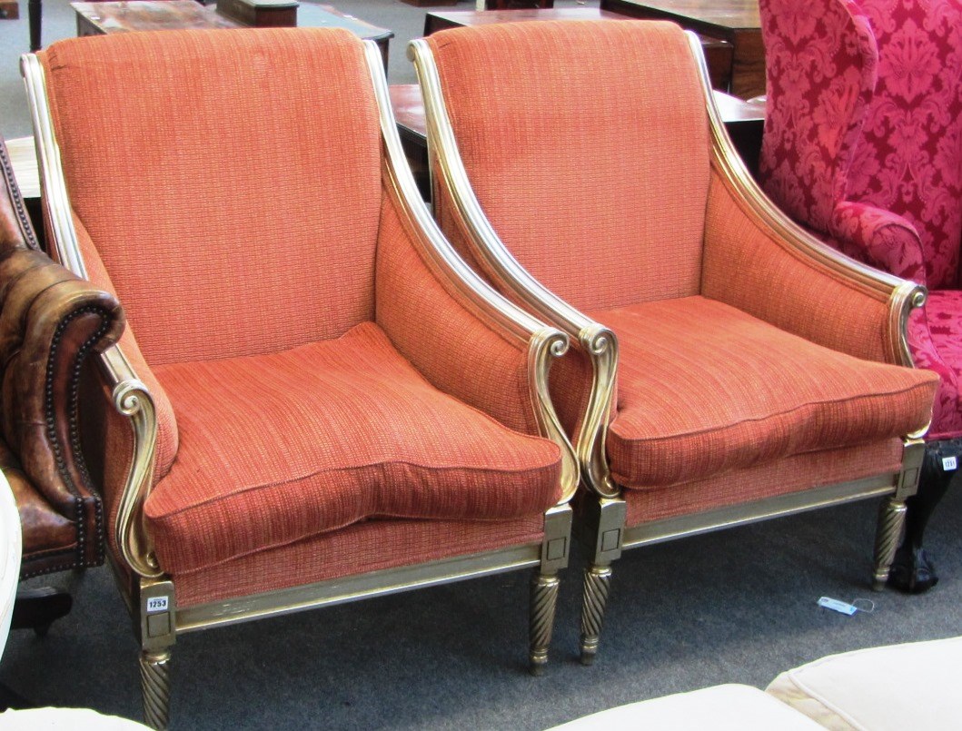 Appraisal: A pair of th century 'Andrew Martin' armchairs upholstered in