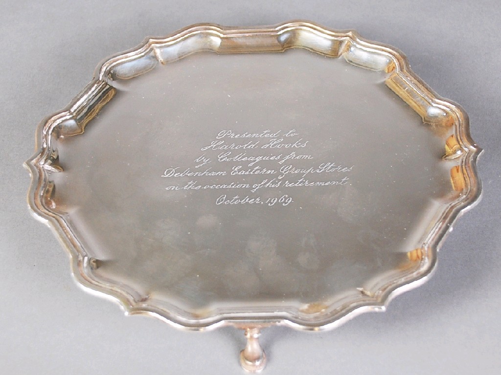 Appraisal: GEORGIAN STYLE CIRCULAR PRESENTATION SALVER raised on three scroll supports