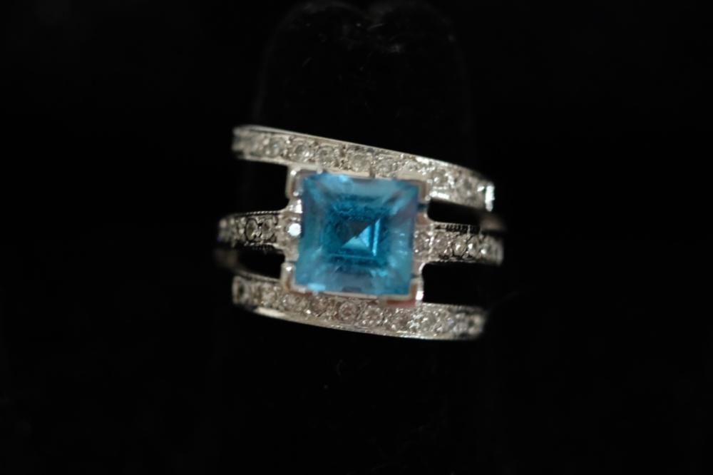 Appraisal: K WG TOPAZ DIAMOND RING SZ k White gold mm