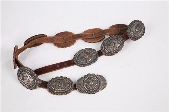 Appraisal: NATIVE AMERICAN CONCHA BELT Twentieth century A hand-worked leather belt