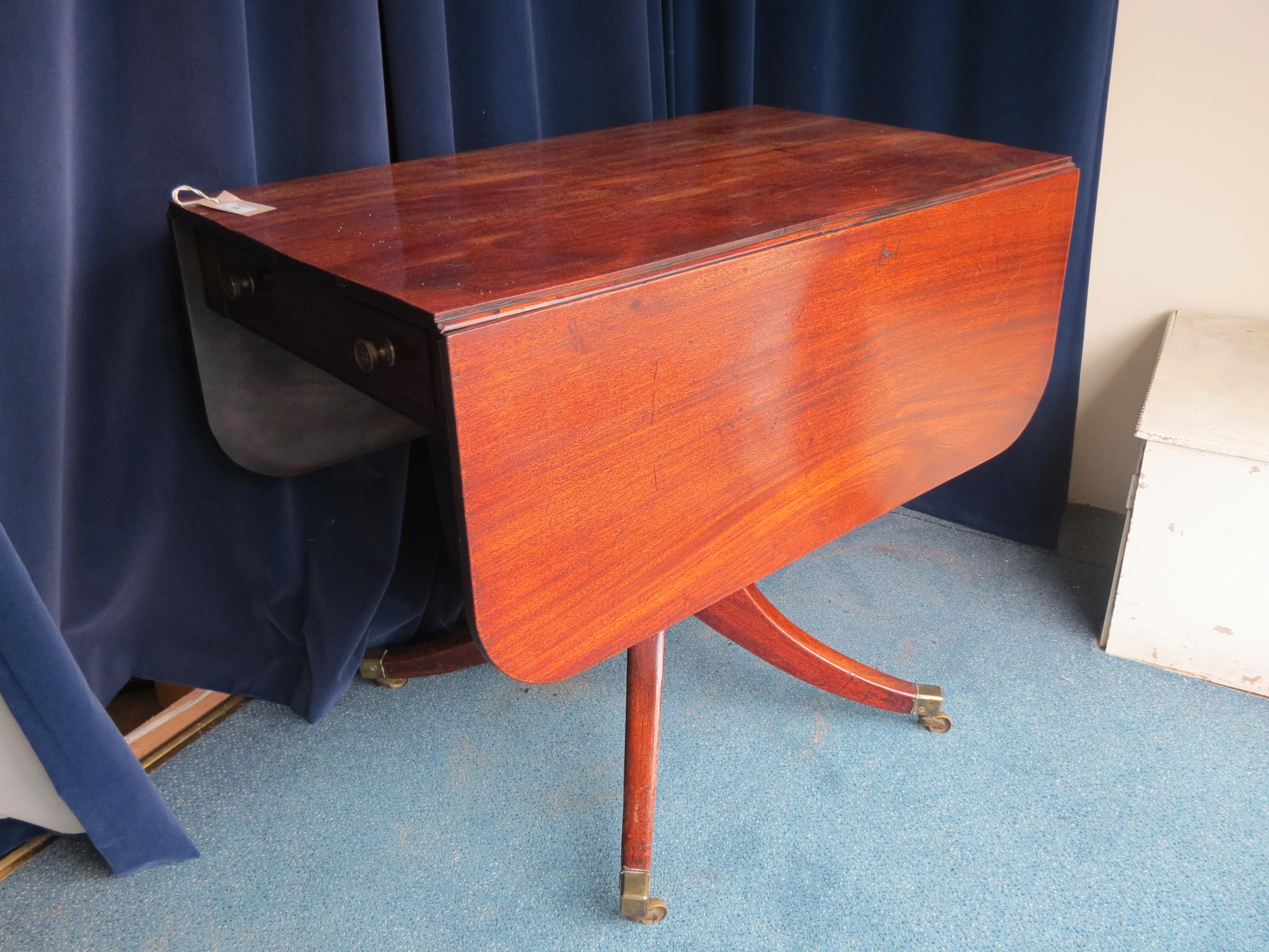 Appraisal: A George III mahogany drop-leaf breakfast table with opposing frieze