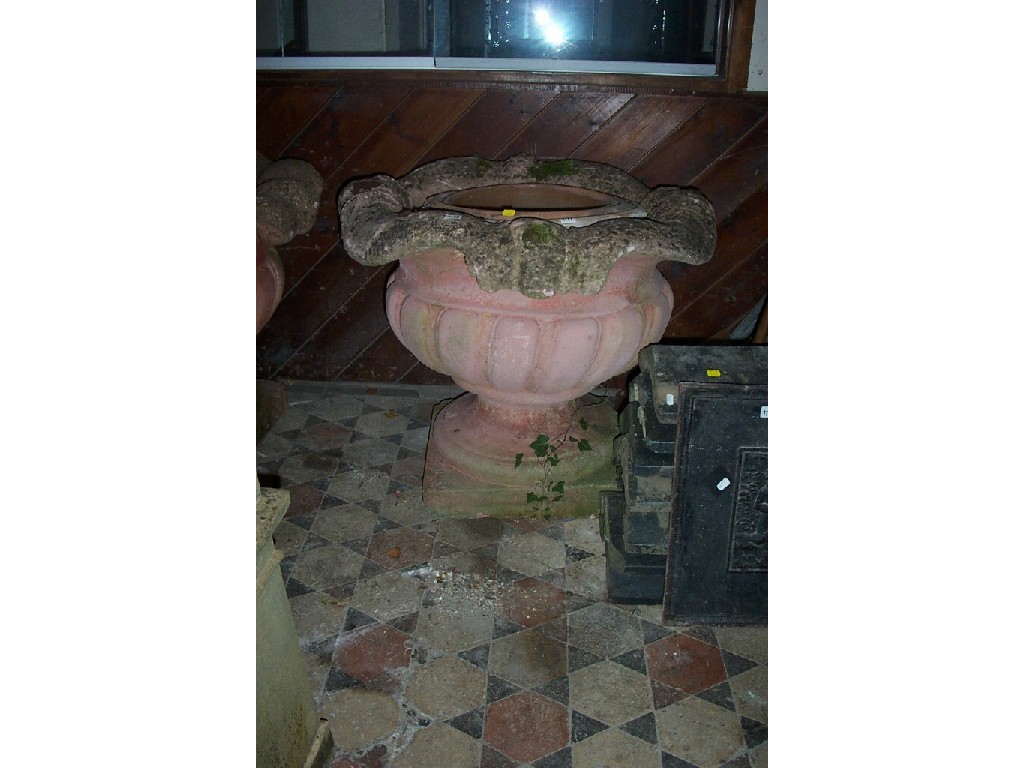 Appraisal: A pair of large weathered composition garden urns fluted bodies