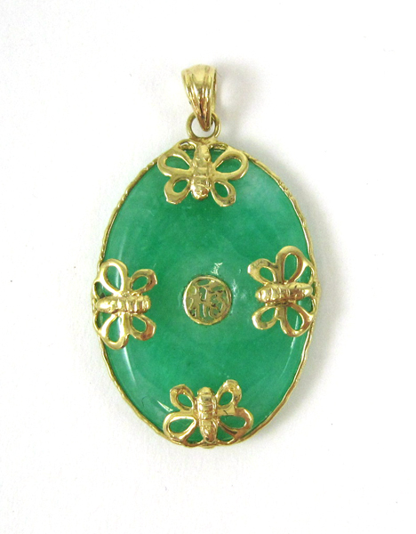 Appraisal: CHINESE JADE AND FOURTEEN KARAT GOLD PENDANT The pendant with