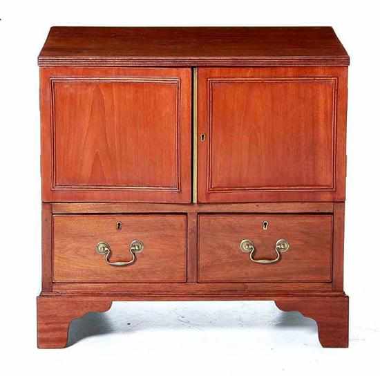 Appraisal: Diminutive Georgian style mahogany cabinet early th century rectangular top