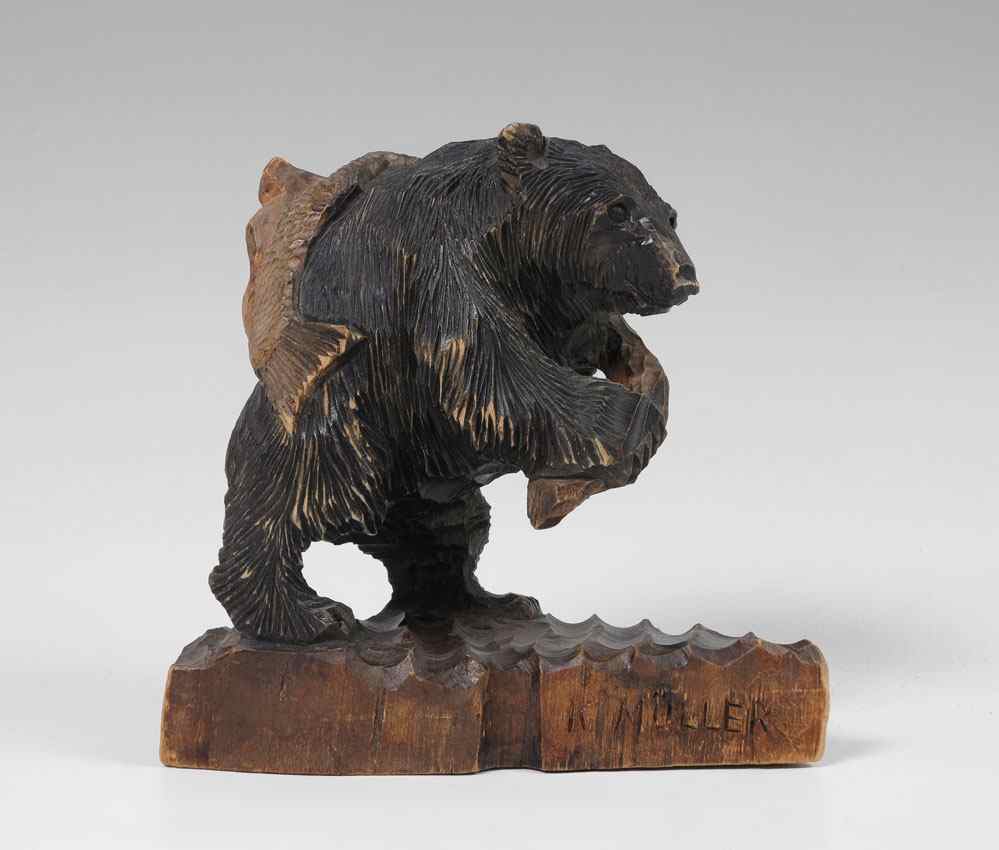 Appraisal: K MULLER BLACK FOREST CARVED BEAR Whimsical carved bear holding