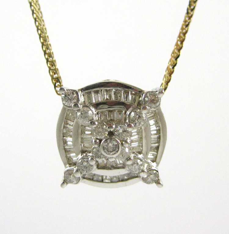 Appraisal: YELLOW AND WHITE GOLD DIAMOND PENDANT NECKLACE with an inch