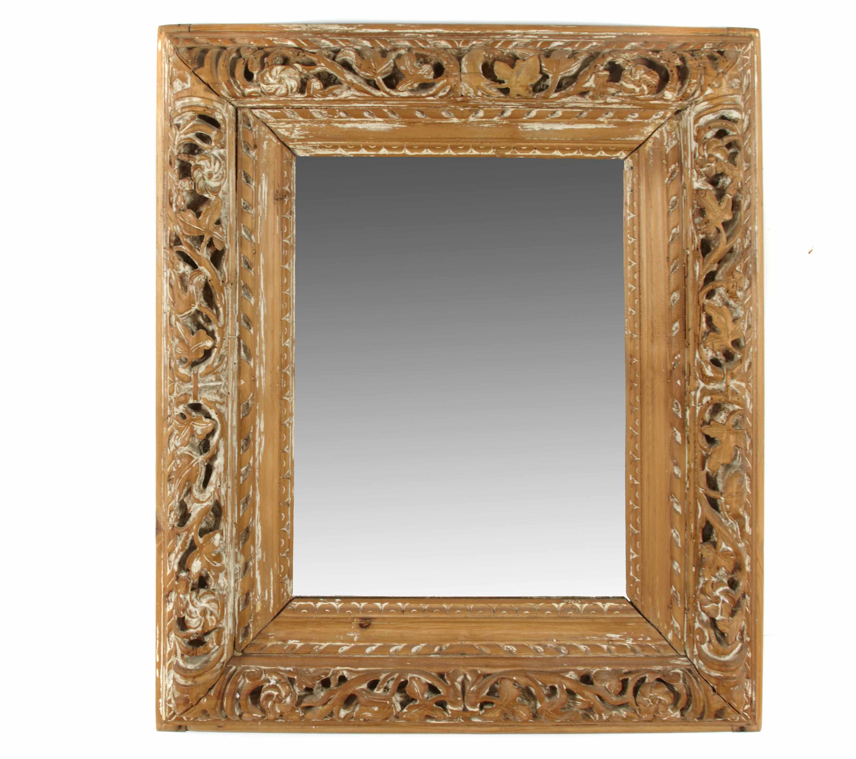 Appraisal: A Continental Baroque style carved pine mirror height in width