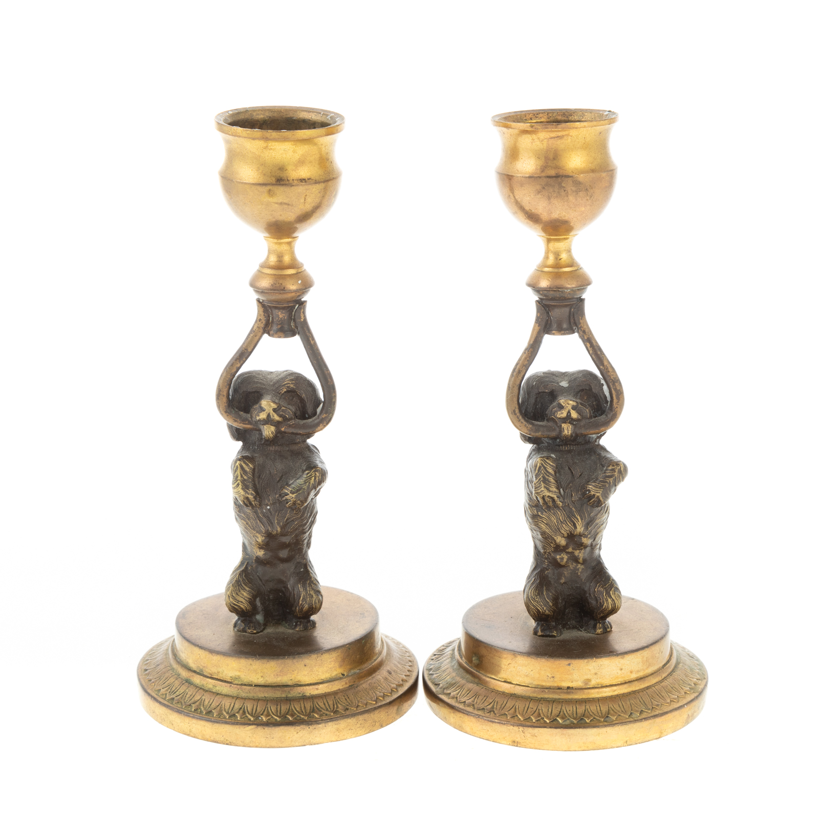 Appraisal: A PAIR OF CONTINENTAL BRONZE FIGURAL CANDLESTICKS th century modeled