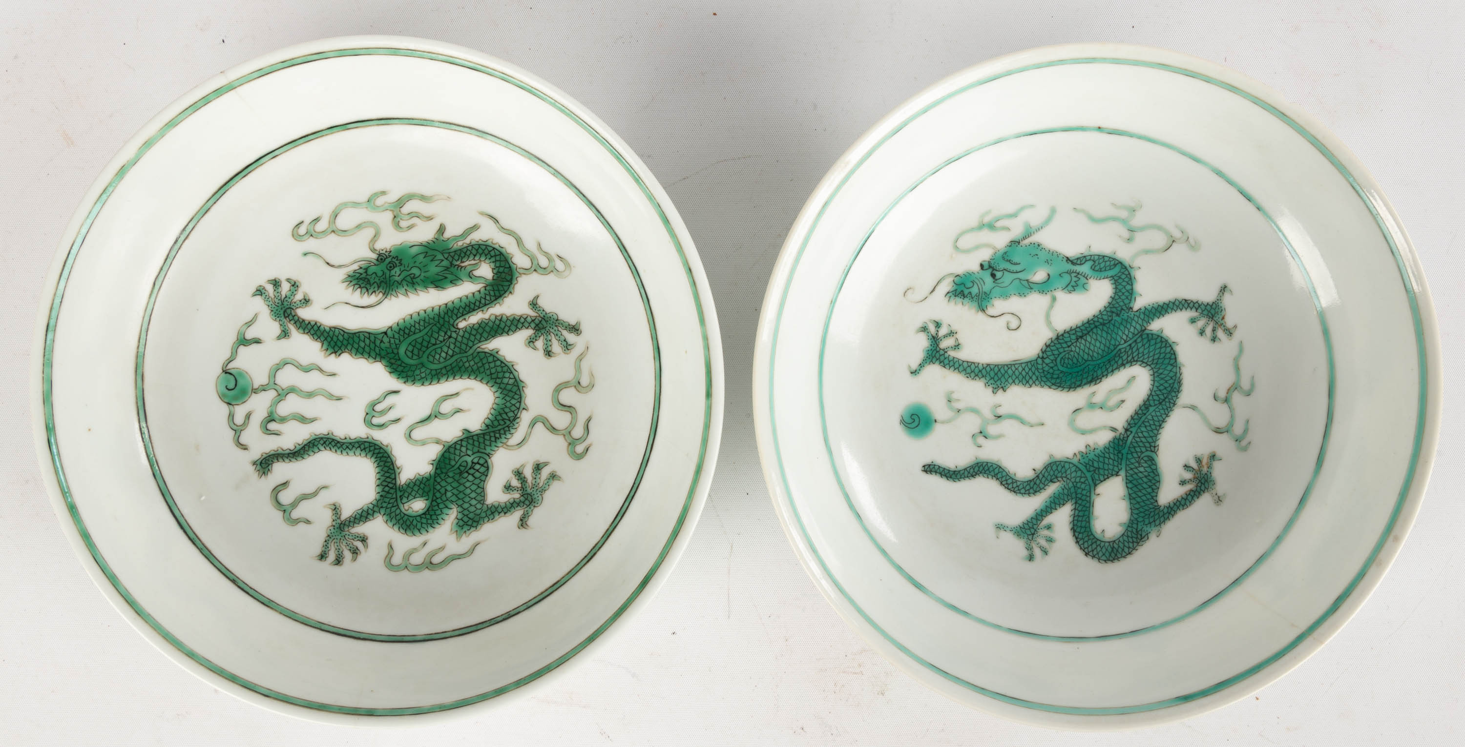 Appraisal: CHINESE PORCELAIN DRAGON DEEP DISHES th century Daoguang seal mark