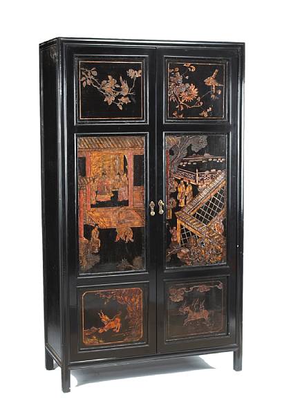 Appraisal: A Chinese style ebonized cabinetincorporating th century Chinese coromandel panels