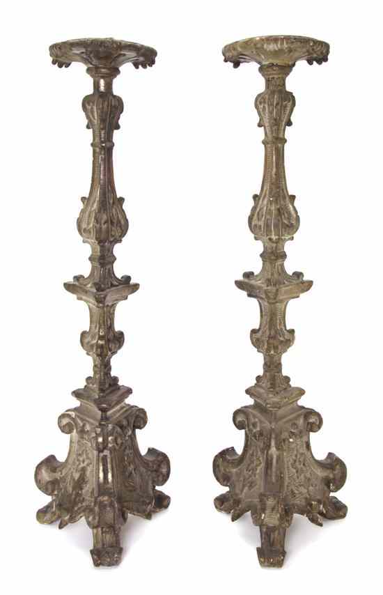 Appraisal: A Pair of Continental Carved Silvered Pricket Sticks each of