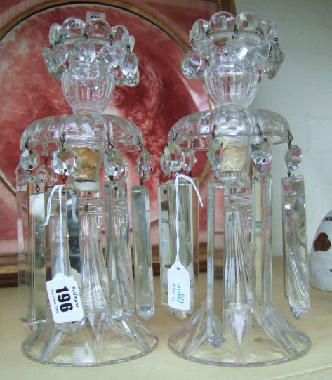 Appraisal: A pair of Victorian glass candlesticks lustres hung with cut