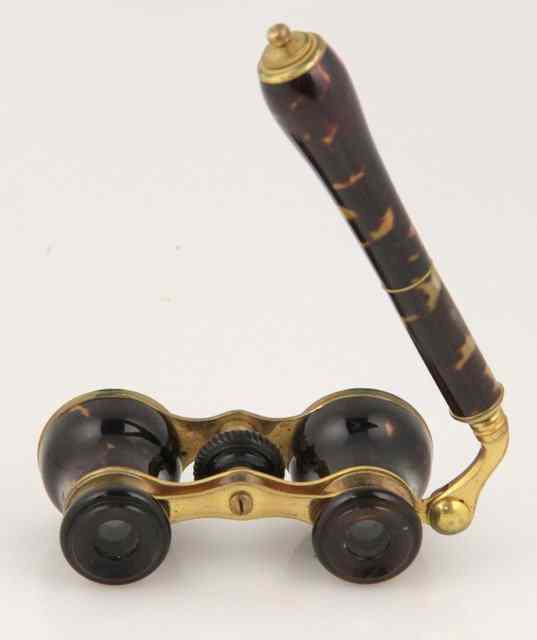 Appraisal: A pair of faux tortoiseshell opera glasses with extending handle