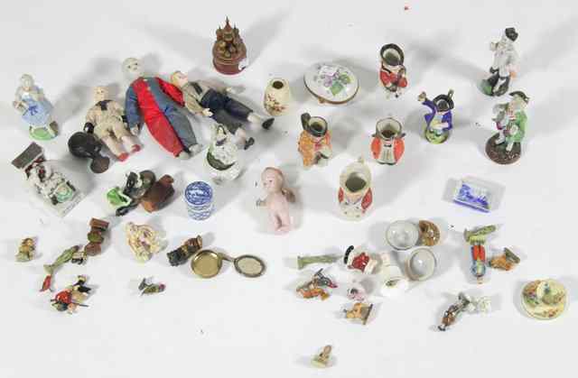 Appraisal: A quantity of miniatures including Toby jugs figures including wood