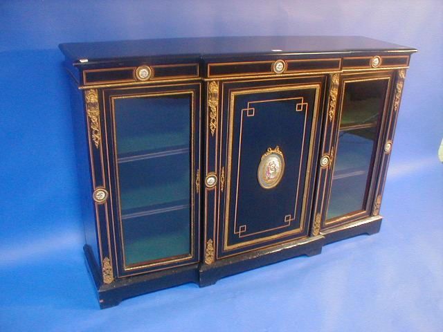 Appraisal: A Victorian ebonised breakfront side cabinet with French porcelain plaques