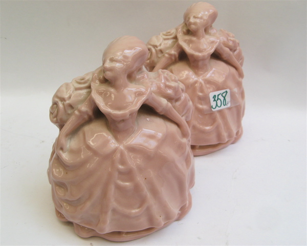 Appraisal: PAIR ROOKWOOD FIGURAL BOOKENDS American colonial ladies in long pink