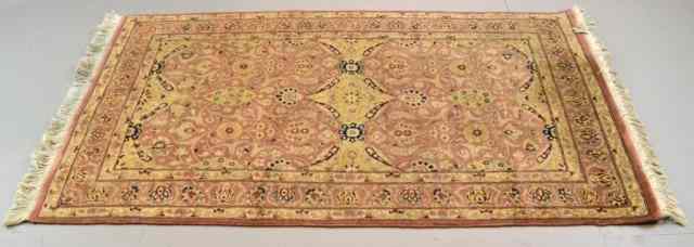 Appraisal: A Persian Wool Area RugRug with salmon ground black and