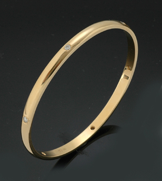 Appraisal: A diamond bangle by Jan Logan The ct gold bangle