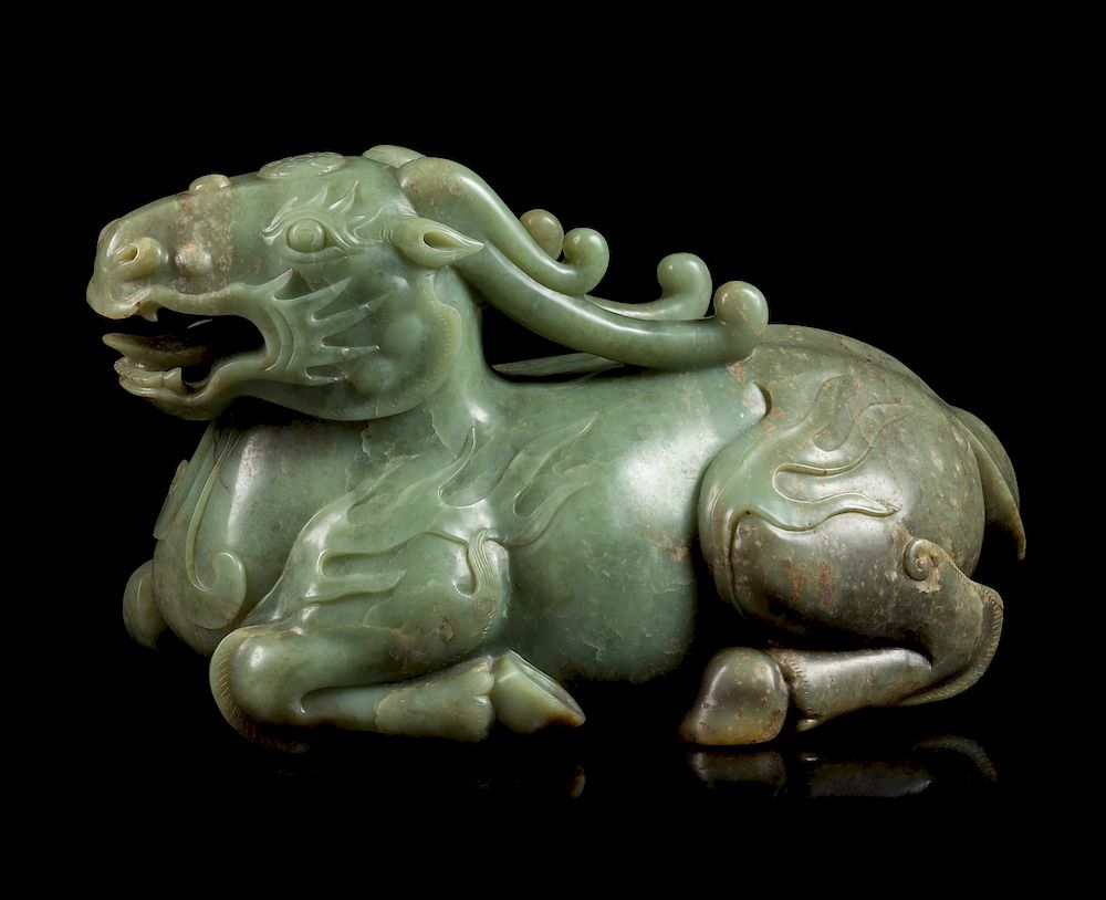 Appraisal: A Celadon Jade Figure of a Recumbent Qilin Height in