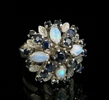 Appraisal: A Sapphire and Opal Dome Ring The white metal ring