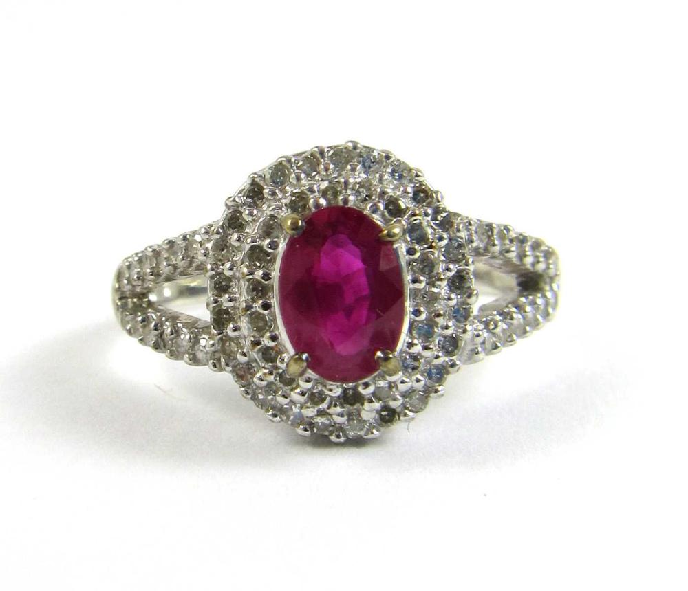 Appraisal: DIAMOND AND SYNTHETIC RED RUBY RING Oval-cut lab created ruby