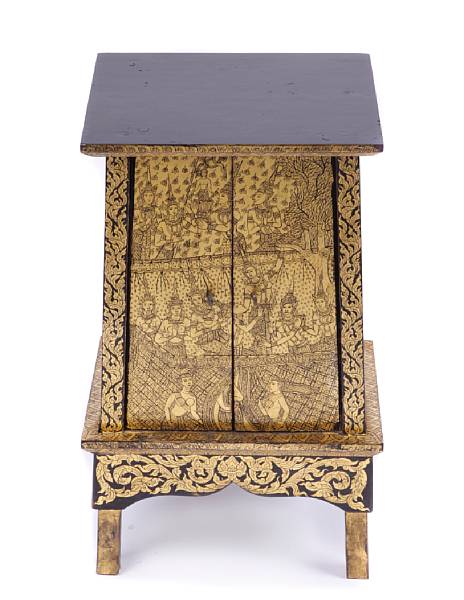 Appraisal: A gold and black painted wood altar cabinet Thai height