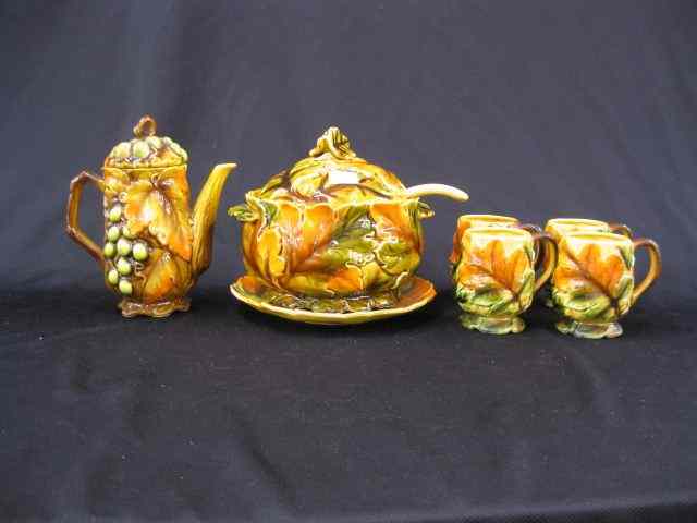 Appraisal: Pottery Soup Tureen together with mugs and a coffeepot leaf