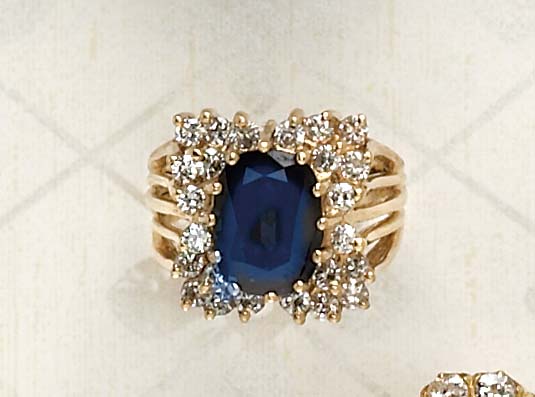 Appraisal: SAPPHIRE AND DIAMOND RING k yellow gold ring set with