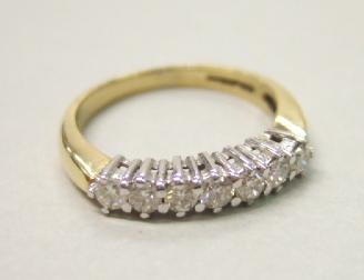 Appraisal: An ct gold and diamond set seven stone half hoop