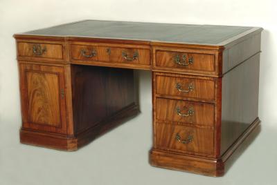 Appraisal: A MAHOGANY PARTNERS DESK of inverted breakfront form with canted