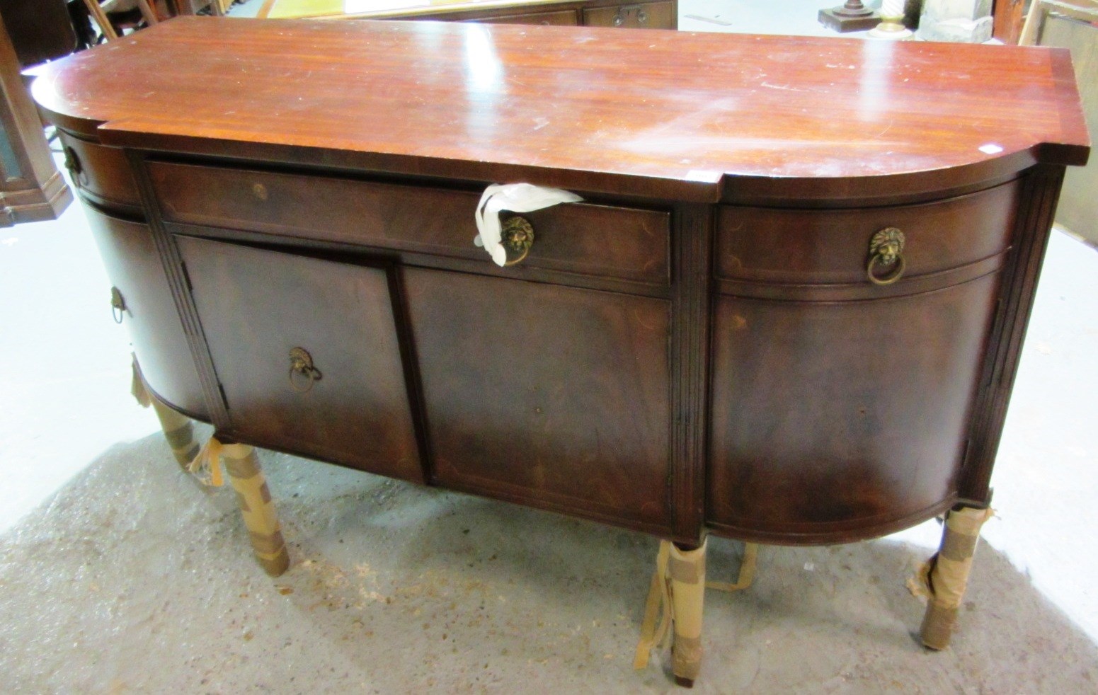 Appraisal: A th century mahogany bowfront sideboard