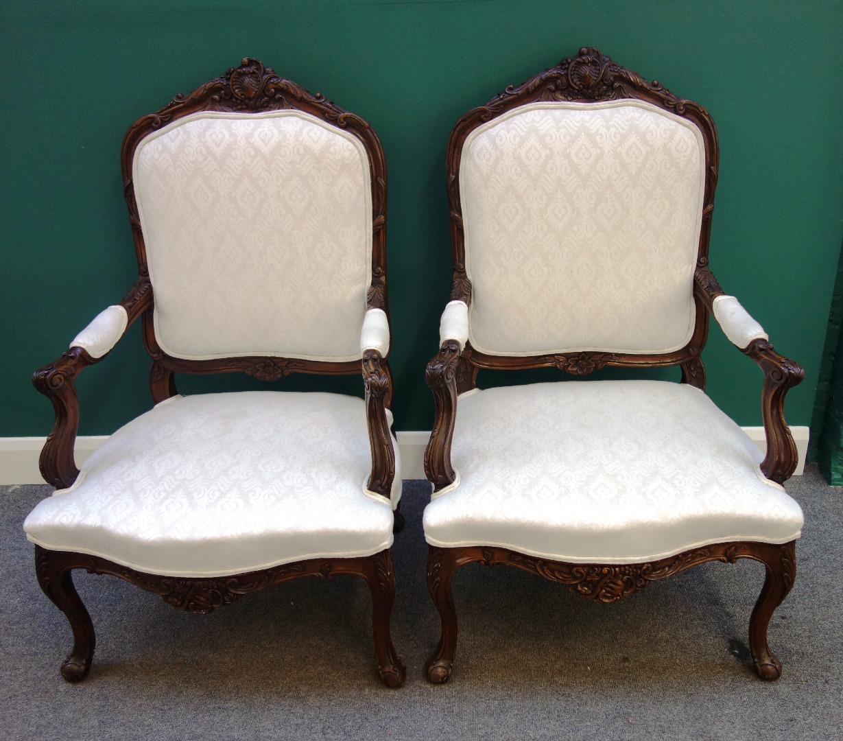 Appraisal: A pair of th century style French carved stained beech