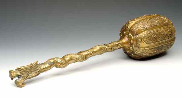 Appraisal: A CHINESE BRASS CEREMONIAL MACE or club with dragon handle