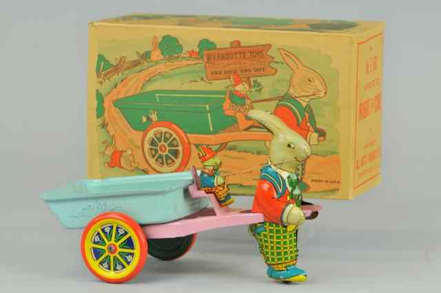 Appraisal: RABBIT DRAWN EASTER CART Wyandotte lithographed tin boxed example depicts