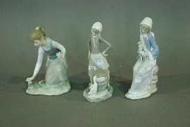 Appraisal: Three Lladro figures of girls with flowers and a duck