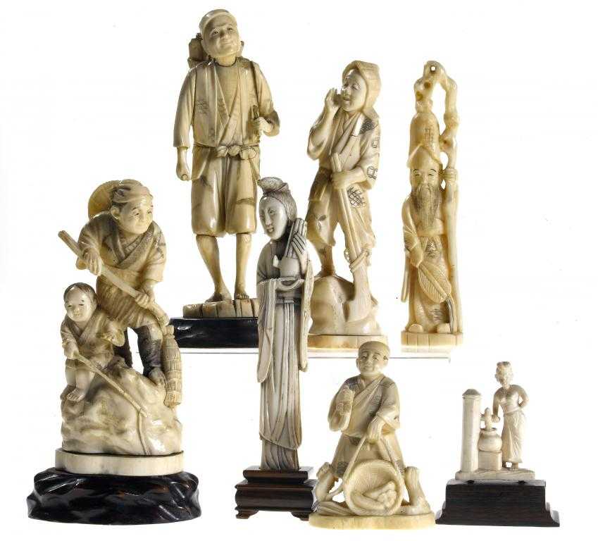 Appraisal: AN IVORY GROUP OF A FISHERMAN AND HIS SON SECTIONAL