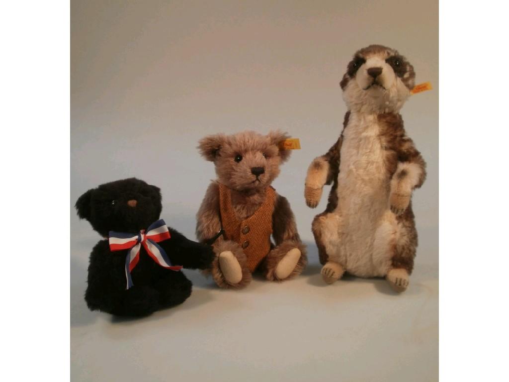 Appraisal: A small Steiff teddy bear wearing a waistcoat and holding