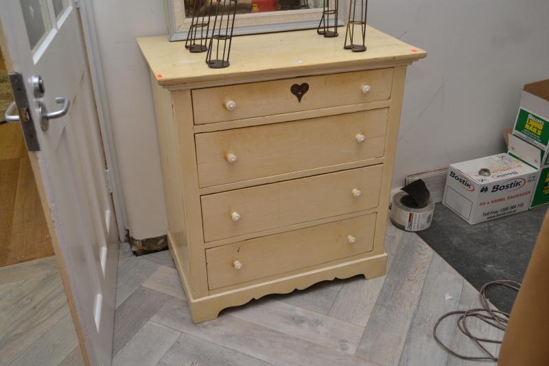 Appraisal: A WHITE PAINTED FOUR DRAWER CHEST A WHITE PAINTED FOUR