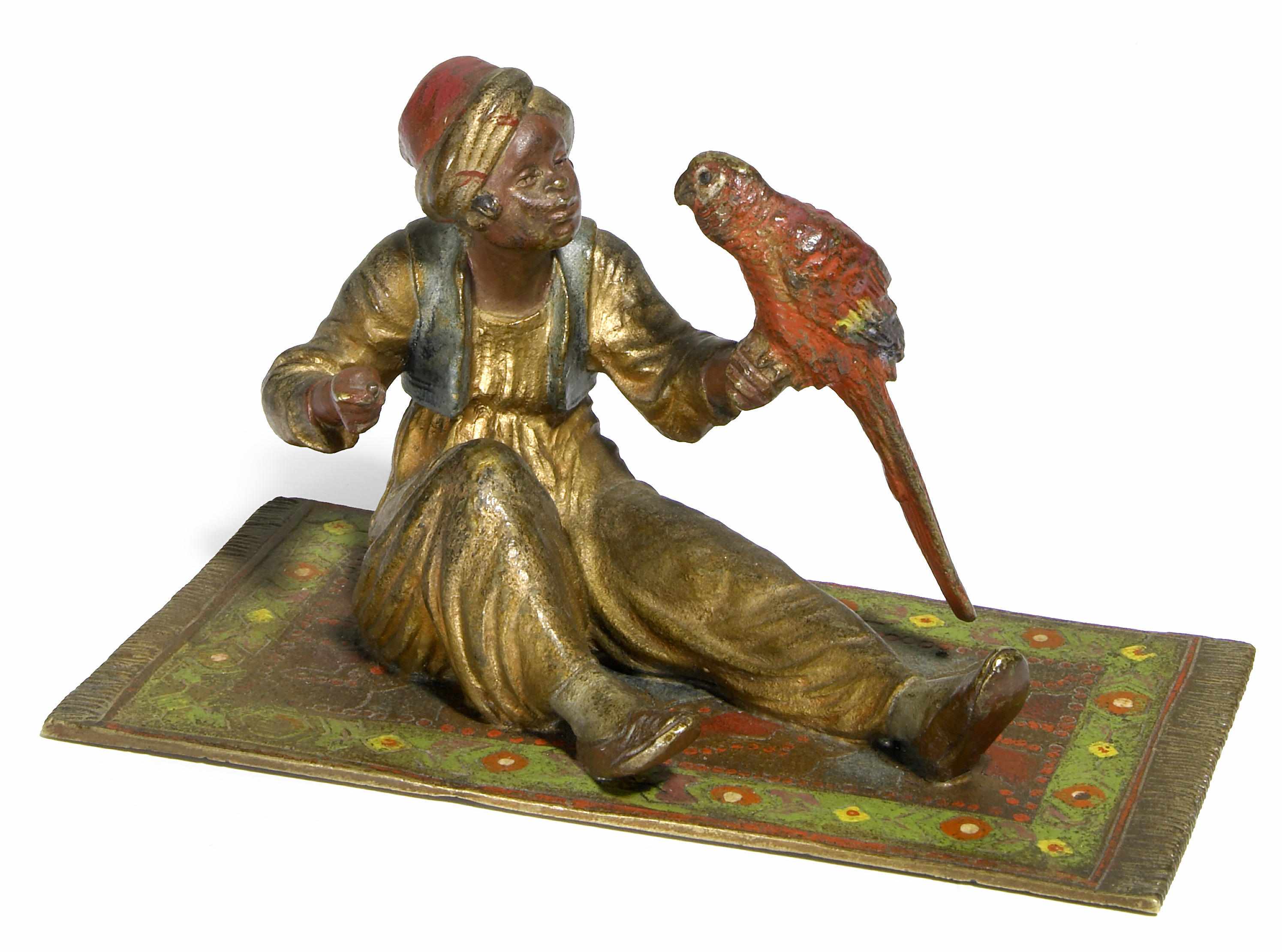 Appraisal: An Austrian cold painted bronze figure of a boy with