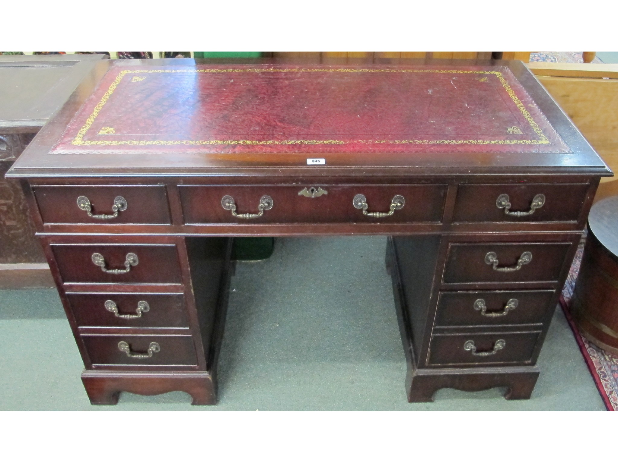 Appraisal: A th Century red leather topped mahogany pedestal desk