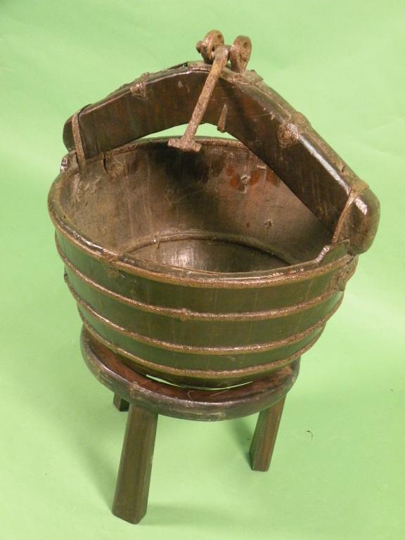 Appraisal: A coopered oak bucket of tapering form with iron bands