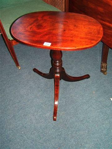 Appraisal: An antique mahogany oval topped tripod occasional table wide